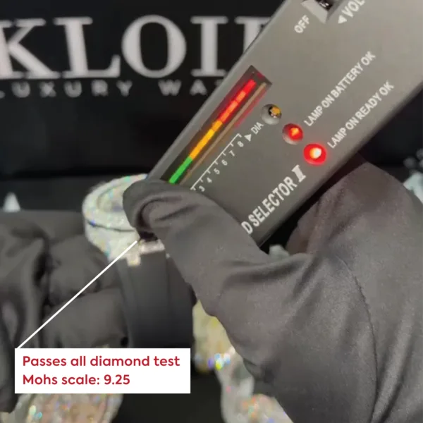 Moissanite diamond watch showcase with diamond tester showing positive result, passes all diamond tests with Mohs hardness scale 9.25.
