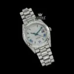 Blue Roman Numerals Dial Baguette Strap Iced Out Moissanite Watch Close Up Front View
