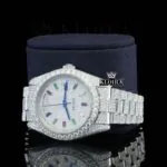 Day Date Display Rainbow Stick Markers Dial Full Iced Out Moissanite Watch Left Profile View