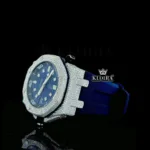 Iced Out Blue Date Display Dial Rubber Strap Moissanite Diamond Watch CLose Up Left Profile View