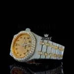 Two Tone Yellow Gold Dial Black Arabic Numerals Bust Down Moissanite Watch Close Up Front View